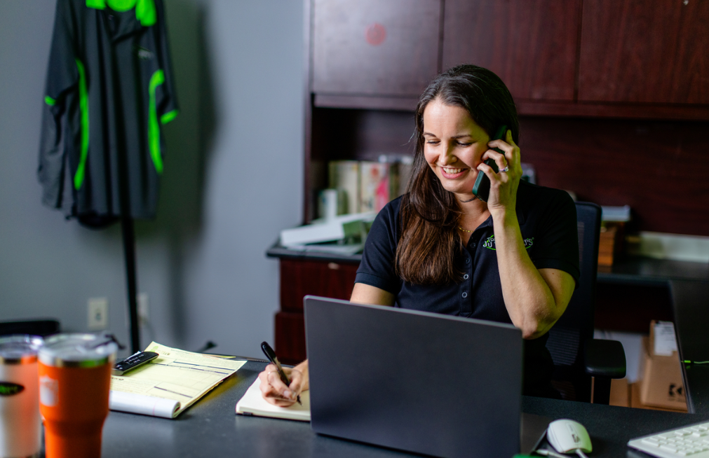 a women on the phone sitting down